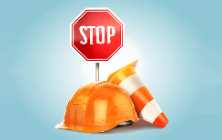 Stop sign and construction hat and cone